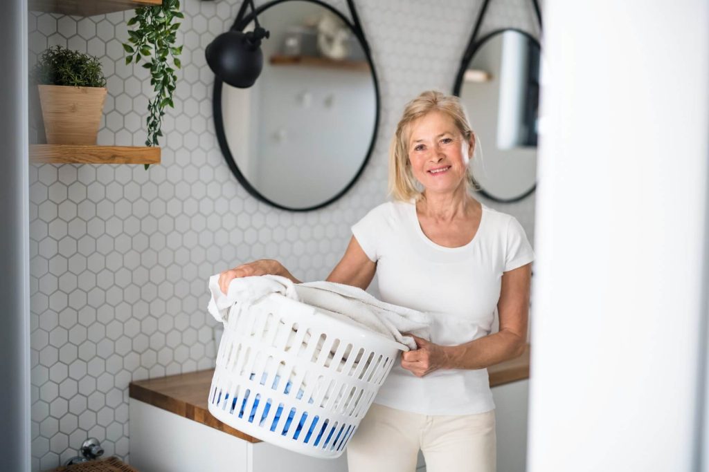 woman carrying laundry